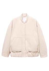 Beige fleece jacket with a round neckline, snap buttons, and two front pockets. Features a relaxed fit and ribbed hem. Soft texture.