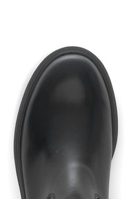 Black leather boot with a rounded toe and smooth finish, featuring a textured black sole. Simple design with no visible hardware or accents.