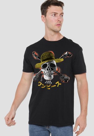Black cotton t-shirt featuring a graphic design of a skull with a straw hat and crossed bones. Text below reads "ONE PIECE" in white and yellow.