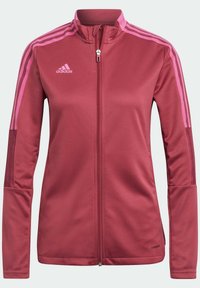 Bordeaux atletisk jacka med rosa ränder, hel dragkedja, hög krage, långa ärmar och ribbade mudd. Har andningsbart material och logotyp.