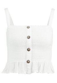 Biała bezrękawnikowa krótka bluzka z gniecionego materiału, z brązowymi guzikami z przodu i falbaną na dole.