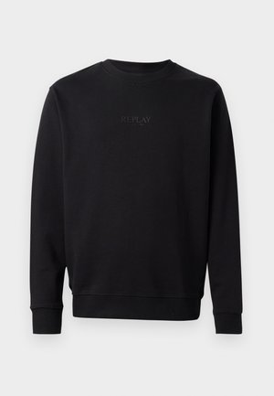 Zwarte sweatshirt gemaakt van zachte katoen met een ronde hals. Kenmerkt zich door een subtiele reliëfprint van het logo "REPLAY SINCE 1981" op de voorkant. Ribgebreide mouwen en onderrand.