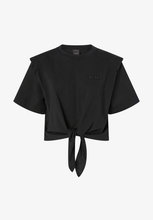 Crna skraćena majica od mekog materijala, s kratkim rukavima, prednjim čvorom i uočenim logotipom brenda na prsima.