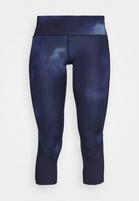 Marinblå capri leggings med ett tie-dye-mönster, tillverkade av ett mjukt, elastiskt tyg. Har en hög midja och sömlösa designaccenter.