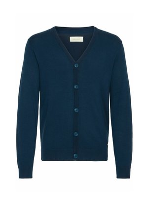 Laivastonsininen neuletakki, V-pääntie, neulottu rakenne, seitsemän napin etuvetoketju, ribbipäät ja helma, sivulla hienovarainen logoelementti.