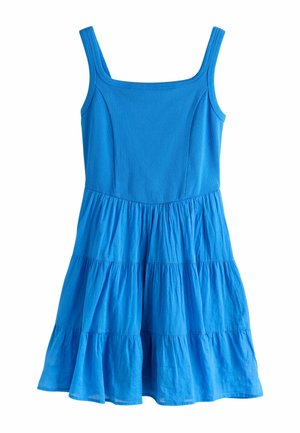 Blå ærmeløs kjole med firkantet udskæring og lagdelt nederdel, lavet af let, tekstureret stof.