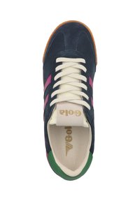 Blue suede sneaker with pink and green accents, cream laces, and a beige tongue featuring gold logo. Gum sole. Rounded shape.