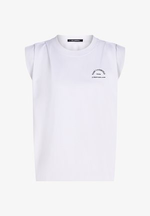 Witte mouwloze top met gewatteerde schouders en zwarte tekst "Karl Lagerfeld Paris 21 Rue St-Guillaume" op de linkerborst.