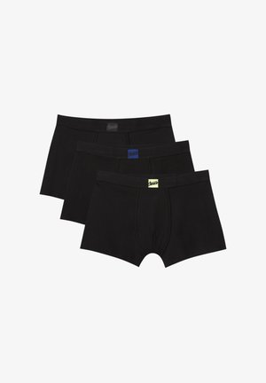 Set van drie zwarte katoenen boxershorts, met elastische taillebanden en variërende logo-kleuren: zwart, blauw en gele accenten.