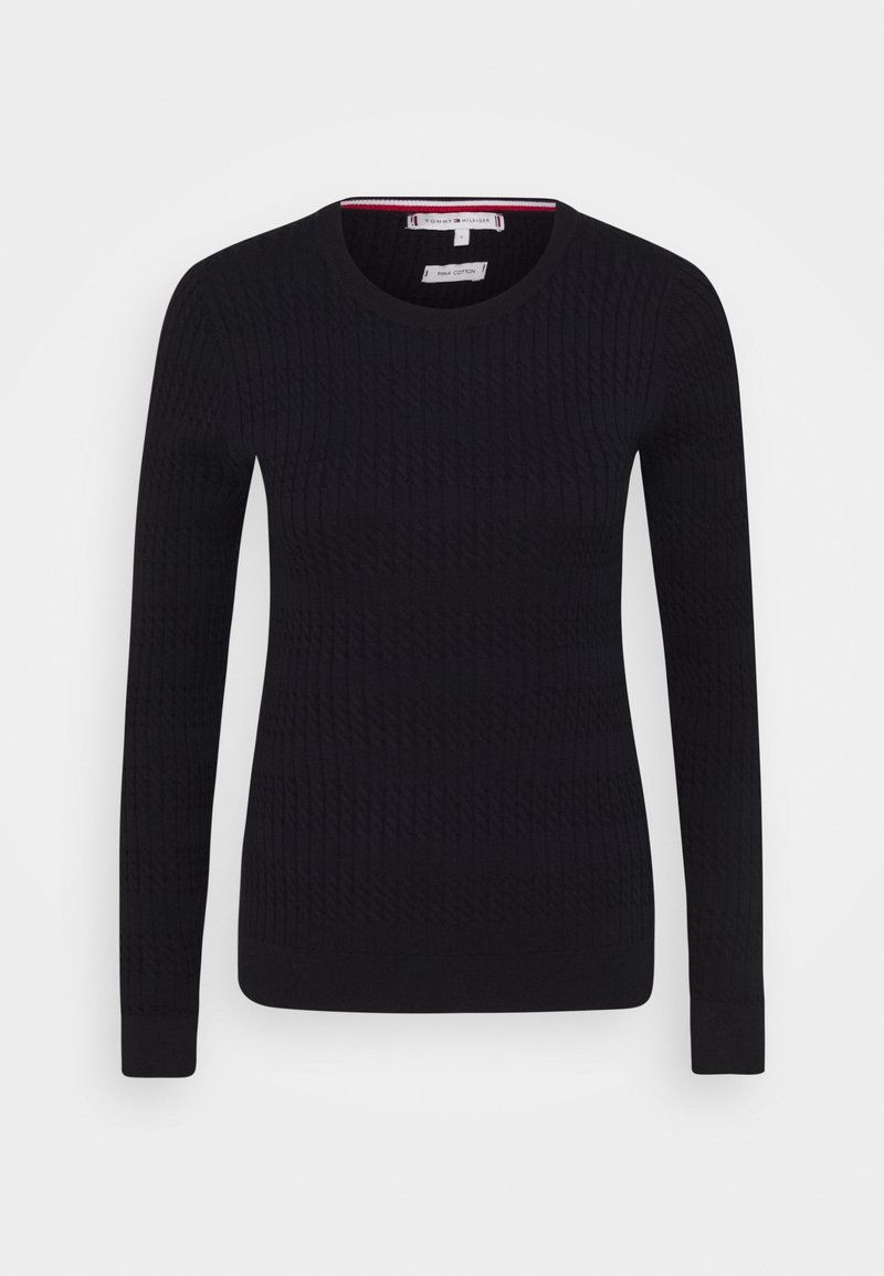 Pull noir à manches longues avec col rond, motif texturé subtil, poignets côtelés et petit logo sur le côté gauche de la poitrine.