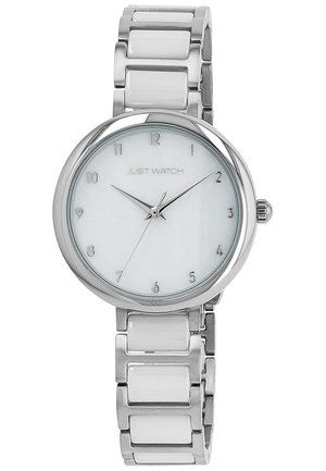 Round silver watch with a white dial, silver hour markers, and a stainless steel bracelet with glossy white links. Brand name "Just Watch" displayed.