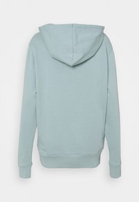 Sudadera azul claro con capucha ajustable, puños y dobladillo acanalados. Tejido suave con una textura lisa, que presenta un diseño casual.