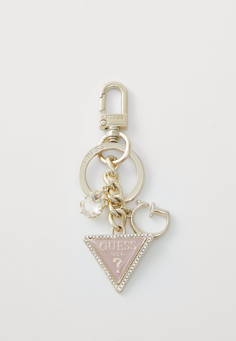 Pink triangular keychain with silver hardware, featuring a crystal pendant and a textured surface with "GUESS U.S.A." embossed.