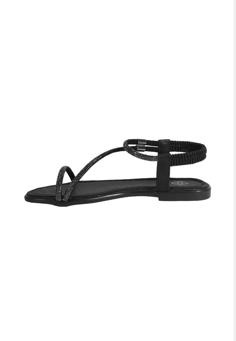 Schwarze flache Sandale mit dünnen, überkreuzten Riemen. Verfügt über einen strukturierten Knöchelriemen und eine glatte, matte Sohle. Minimalistisches Design.