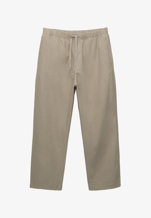 Beige katoenen broek met een elastische tailleband en een verstelbaarkoord. Rechte pijpen ontwerp met zijzakken en een gladde textuur.