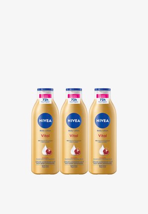 Three gold-colored NIVEA Vital body lotion bottles with blue caps, labeled for 72-hour moisture and pomegranate macadamia serum, arranged side by side.