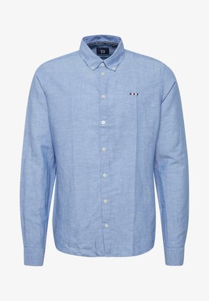 Light blue long-sleeve button-up shirt in linen blend, featuring a classic collar, front pocket with stripes, and white buttons.