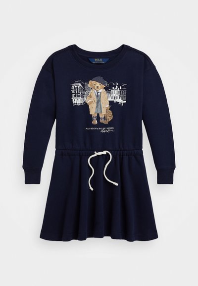 Mornarsko modra obleka z dolgimi rokavi, z oprijetim zgornjim delom in razširjenim krilom, ki vsebuje grafiko "Polo Bear" in vrvico za uravnavo prileganja.