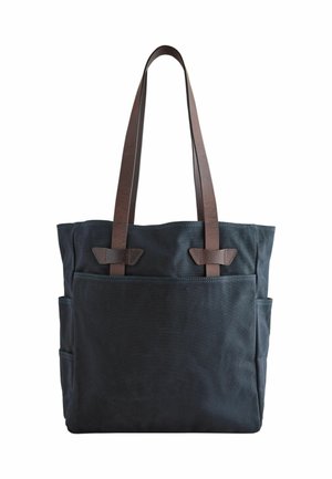 Schwarze Canvas-Tragetasche mit zwei langen braunen Lederschulterriemen und einer großen Fronttasche.