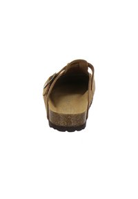 Braune Wildleder-Sandale mit verstellbarem Riemen, Korkfußbett, strukturiertem Gummisohle und offenem Rückendesign.