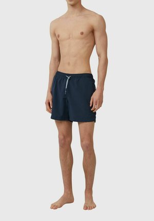 Navy blue swim shorts made of lightweight fabric, featuring an elastic waistband with a drawstring and side pockets.