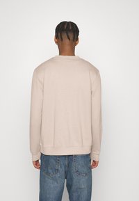 HUGO DURAGOL - Melegítőfelső - medium beige