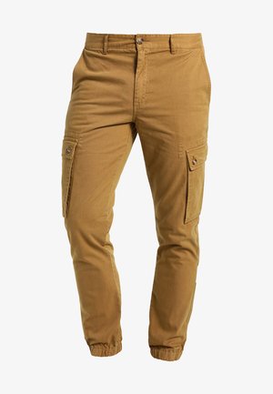 Beige Cargo-Hosen aus Baumwollmischung, mit Seitentaschen, Knopfverschluss, elastischen Bündchen und weicher Textur.