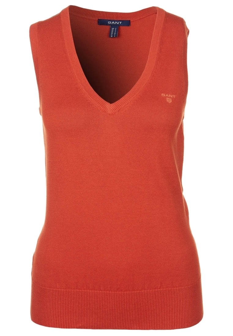 Halenka bez rukávů s V-výstřihem v oranžové barvě. Vyrobena z žebrovaného materiálu s přiléhavým střihem. Obsahuje malé logo na hrudi a rovný lem.