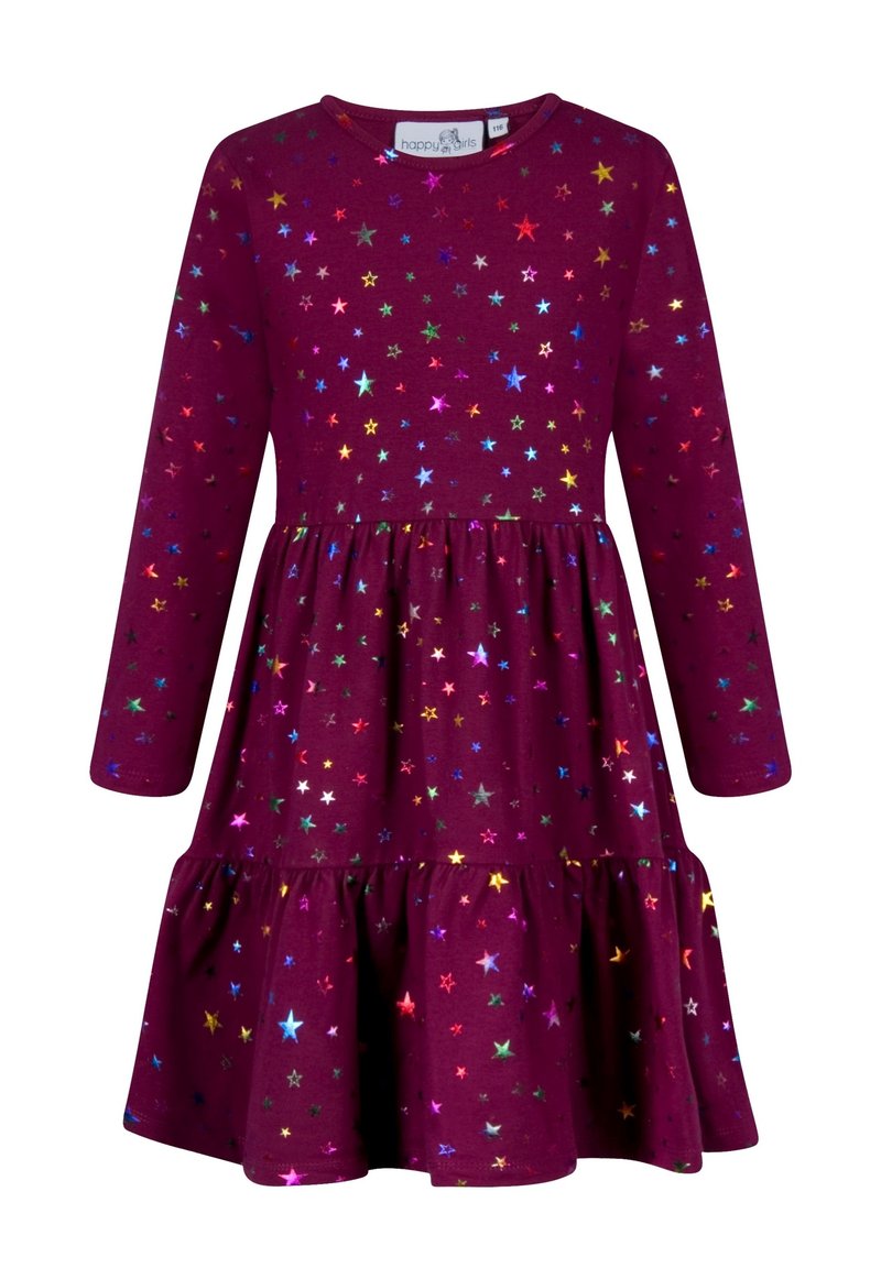 Pitkähihaista mekkoa tumman viininpunaisesta kankaasta, jossa on monivärisiä tähtikuoseja. Hameessa on röyhelöhelma ja pyöreä pääntie.