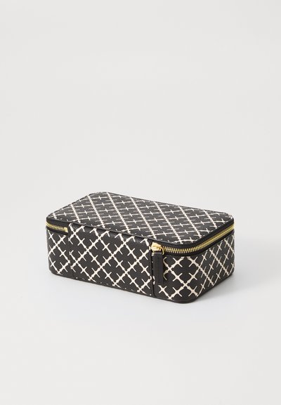 Black and cream geometric patterned cosmetic bag with a rectangular shape, gold zipper, and textured surface.