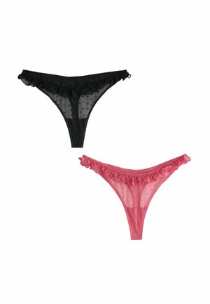 Schwarze und pinke transparente Strings mit Punktmuster und Rüschensäumen. Der schwarze String liegt über dem pinken, beide bieten minimalen Schutz.
