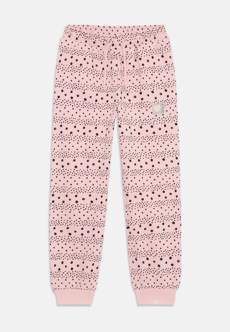 Rosa treningsbukser med svarte prikkede mønstre, elastisk midje, snøring og ribbestrikkede mansjetter. Har en liten merkelapp på venstre side.