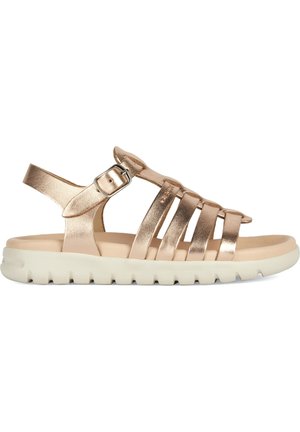 Metallic gold sandal with multiple straps, adjustable ankle buckle, soft beige footbed, and a textured white rubber sole.