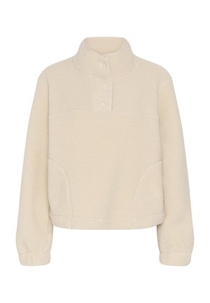 Kreemivärvi fliisist pusa pikkade varrukate, püstiääre ja kolmega nööbiga kaeluses, millel on elastsed varrukaotsad.