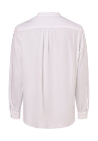 White long-sleeve shirt made of lightweight fabric. Features a back yoke and gathered detailing, with buttoned cuffs and a rounded hem.