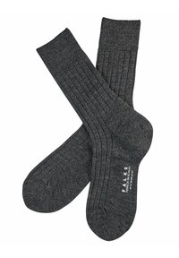 Grå ribbede sokker fremstillet af et blødt strikmateriale, der har en forstærket tå og hæl med et logo trykt på sålen.