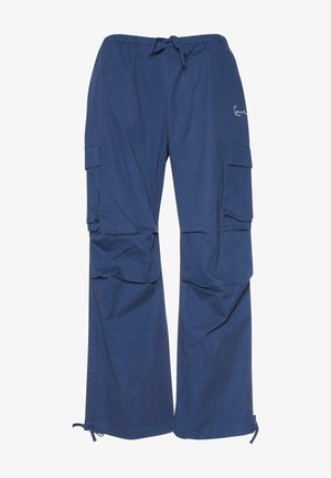 Modré cargo nohavice vyrobené z bavlny, s pružným pásom na šnúrku, dvoma bočnými vreckami a voľným strihom so žebrovanými koncami na členkoch.
