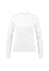 Top bianco a maniche lunghe in pizzo, con motivi floreali, collo alto e dettagli testurizzati su tutta la stoffa.