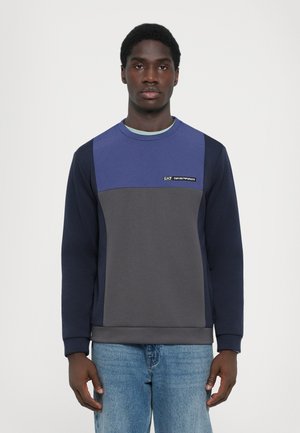 Navy blue and gray sweatshirt with a crew neckline, featuring a color-block design and EA7 logo on the chest. Soft texture, casual fit.