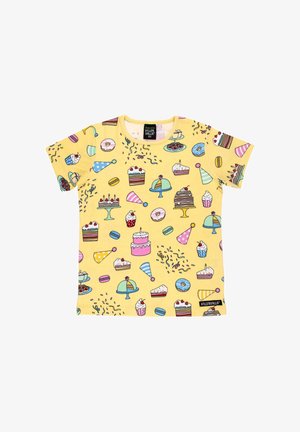 Yellow short-sleeve t-shirt featuring a colorful dessert-themed print, including cakes, ice cream, and donuts. Soft fabric, crew neck design.