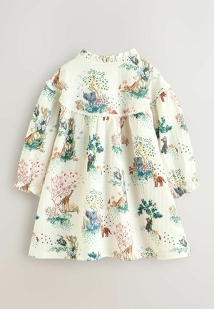 Langärmliges Kleid aus cremefarbenem Stoff mit einem Naturdruck, der Tiere, Blumen und Bäume zeigt. Rüschen-Ausschnitt und gemusterte Textur.