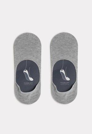 Graue Stretch-Baumwollsocken mit einem niedrigen Schnitt und einem Silikon-Griff an der Ferse. Die Verpackung hat einen schwarzen Hintergrund mit einem weißen Logo.