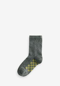 Grau Socke mit strukturiertem Finish, ausgestattet mit einem gelben Schachbrettmuster an der Knöchelpartie. Standard Crew-Länge mit geripptem Bund.