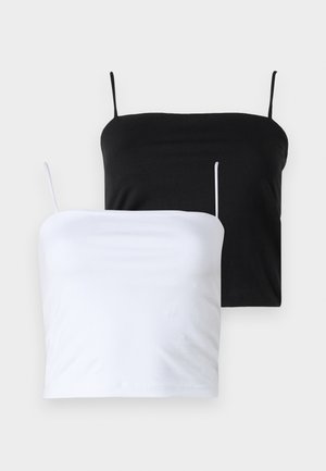 Deux débardeurs ajustés en noir et blanc. Fabriqués en tissu doux avec des bretelles fines et réglables. Texture lisse, design simple, sans motifs notables.