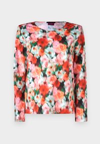 Langermet topp med et livlig blomsterdesign i røde, rosa og grønne nyanser på en mørk bakgrunn. Glatt stoff med rund utringning.