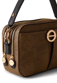 Brown textured leather handbag with a rectangular shape, dual gold zippers, black accents, and a circular gold logo detail.