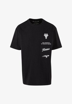 Črna bombažna majica s klasičnim okroglim izrezom. Z белим natisnjenim besedilom: "Univerza Texas v Austinu" in "Texas", ter logotipom.