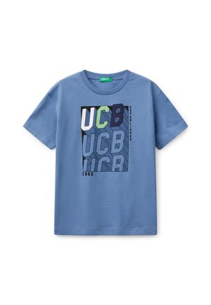 Blue cotton t-shirt featuring a graphic design with the letters "UCB" in varying sizes and colors. Short sleeves and round neckline.
