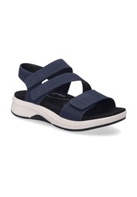 Námořnické modré sandály s nastavitelnými suchými zipy, polstrovanou stélkou a bílou gumovou podrážkou. Mají zaoblenou špičku a design s podporou klenby.
