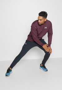 Under Armour RIVAL FLEECE - Træningsbukser - black/white